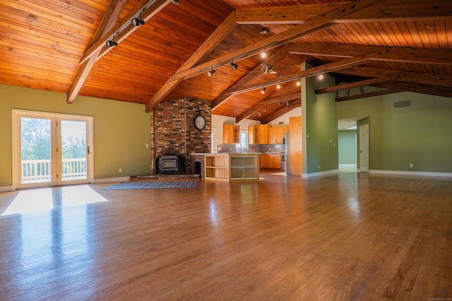 125 Woodchuck Ln, Harwinton, CT 06791 - unfurnished living room featuring wooden ceiling with exposed beams, track lighting, baseboards, a fireplace, and wood finished floors