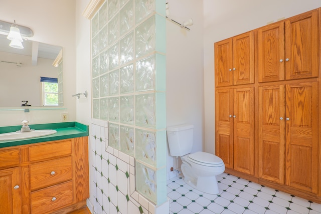 125 Woodchuck Ln, Harwinton, CT 06791 - bathroom featuring vanity, toilet, tile patterned floors, and beam ceiling