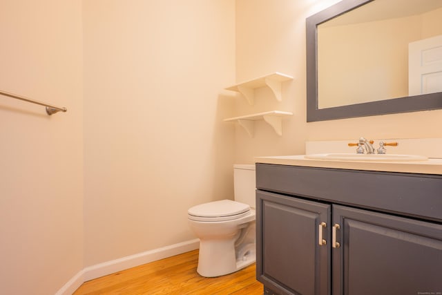 125 Woodchuck Ln, Harwinton, CT 06791 - bathroom with wood finished floors, vanity, baseboards, and toilet