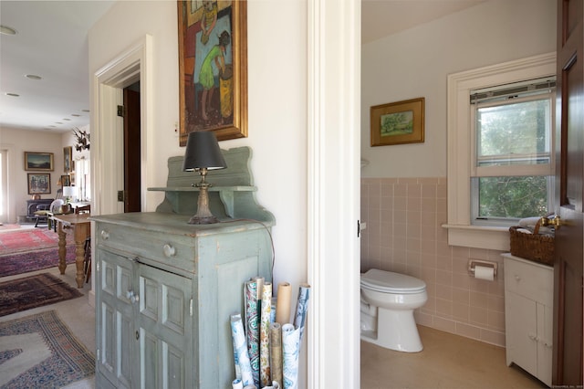 308 Main St, Salisbury, CT 06039 - bathroom with tile walls, toilet, and wainscoting