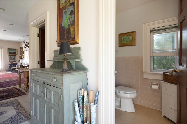 308 Main St, Salisbury, CT 06039 - bathroom featuring tile walls, toilet, and a wainscoted wall