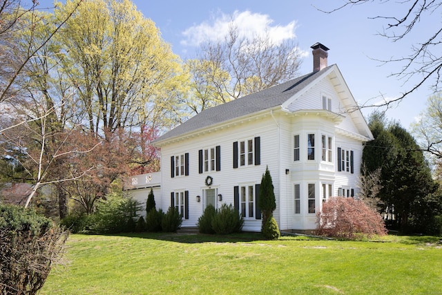 308 Main St, Salisbury, CT 06039 - neoclassical / greek revival house featuring a chimney, a front lawn, and roof with shingles