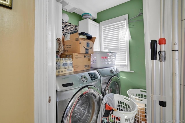 809 Burnside Ave, East Hartford, CT 06108 - laundry area featuring washing machine and clothes dryer and cabinet space