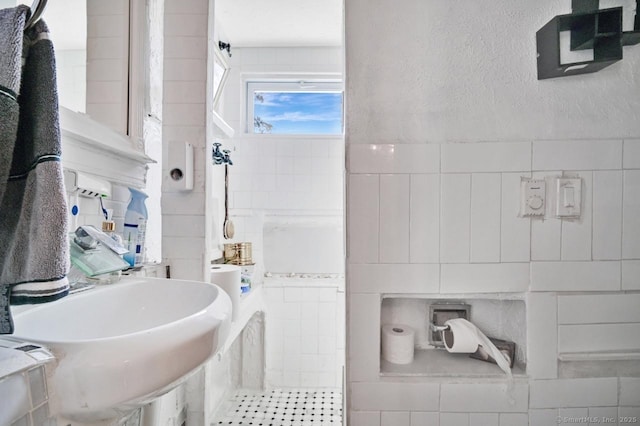 809 Burnside Ave, East Hartford, CT 06108 - bathroom with tile walls and a sink