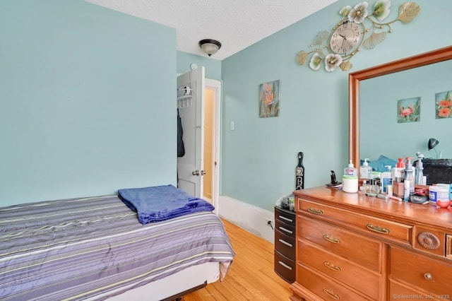 809 Burnside Ave, East Hartford, CT 06108 - bedroom featuring light wood-style flooring and a textured ceiling