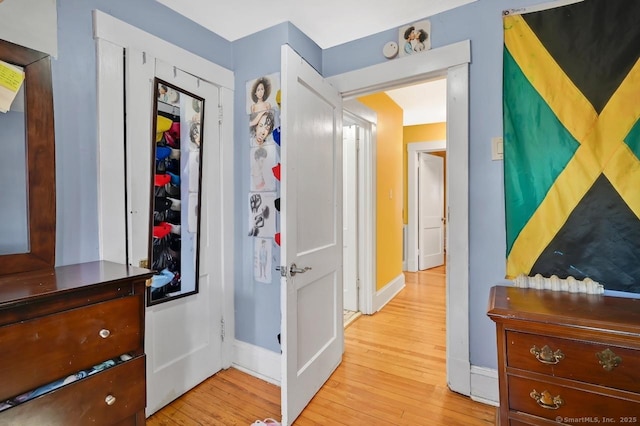 809 Burnside Ave, East Hartford, CT 06108 - corridor featuring light wood finished floors and baseboards