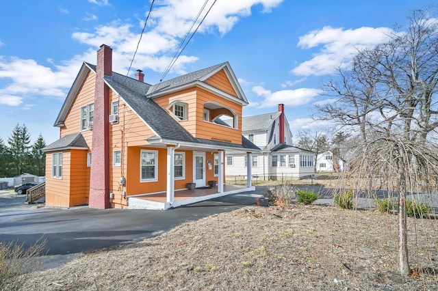 809 Burnside Ave, East Hartford, CT 06108 - rear view of property with a porch, a chimney, and roof with shingles