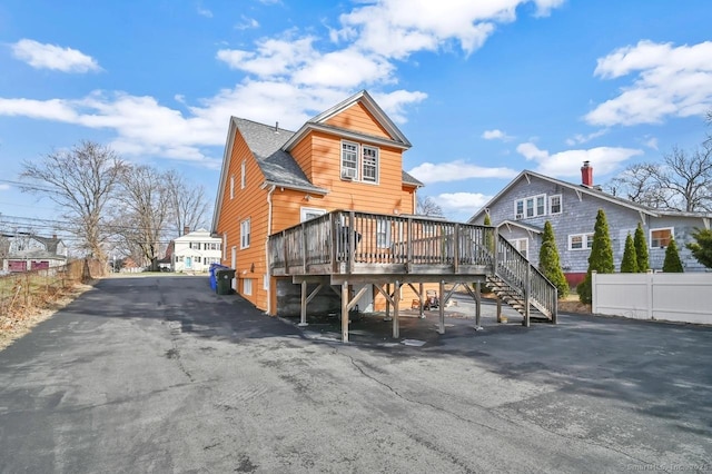 809 Burnside Ave, East Hartford, CT 06108 - rear view of house with a wooden deck, stairs, and a shingled roof