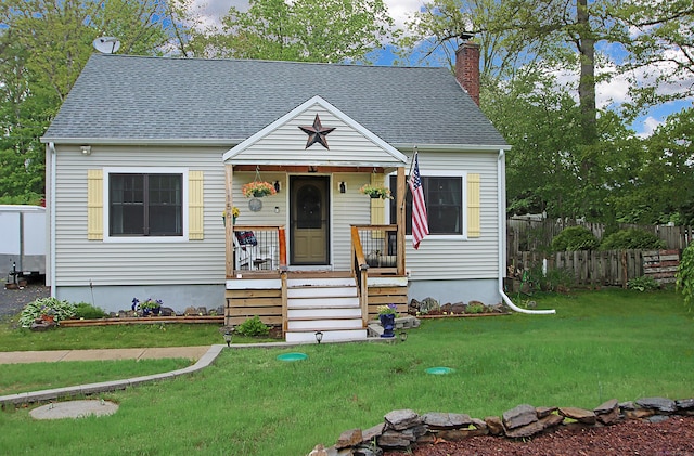 156 Clinton Hill Rd, Wolcott, CT 06716 - view of front facade featuring a chimney, roof with shingles, and a porch