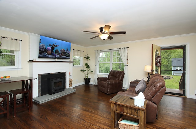 156 Clinton Hill Rd, Wolcott, CT 06716 - living area with wood finished floors, ceiling fan, a fireplace with raised hearth, ornamental molding, and baseboards