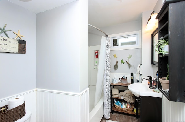 156 Clinton Hill Rd, Wolcott, CT 06716 - bathroom featuring vanity, wainscoting, toilet, shower / bath combo with shower curtain, and wood finished floors
