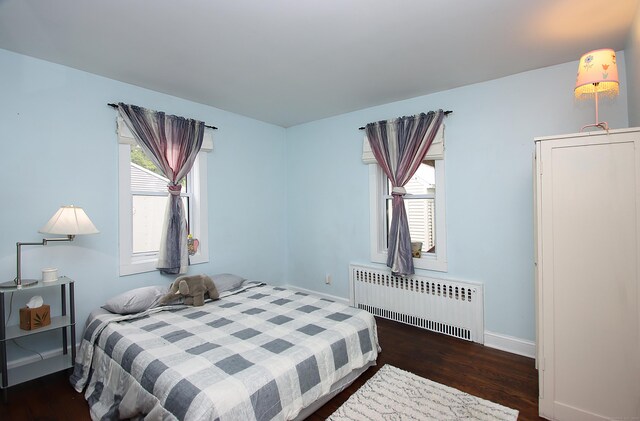 156 Clinton Hill Rd, Wolcott, CT 06716 - bedroom with radiator, wood finished floors, multiple windows, and baseboards