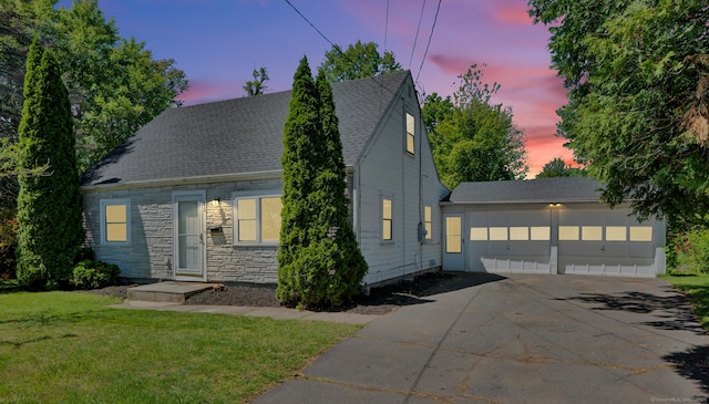 43 Ronald Rd, New Britain, CT 06053 - view of front of house with a garage, a front lawn, stone siding, and roof with shingles