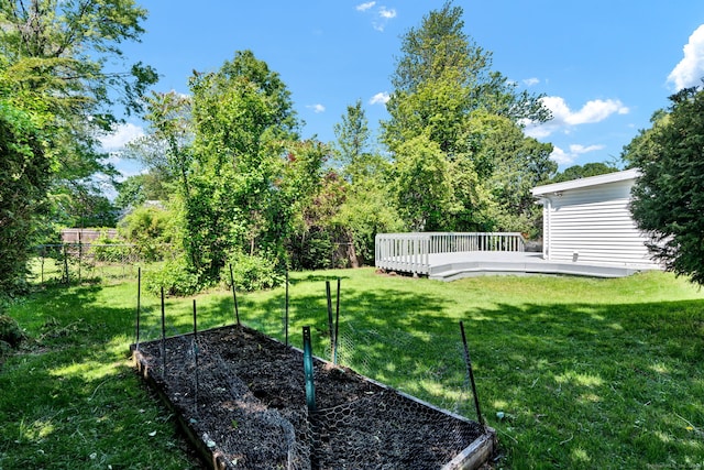 43 Ronald Rd, New Britain, CT 06053 - view of yard featuring a wooden deck and a vegetable garden