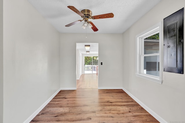 43 Ronald Rd, New Britain, CT 06053 - empty room featuring wood finished floors, baseboards, a textured ceiling, and a ceiling fan