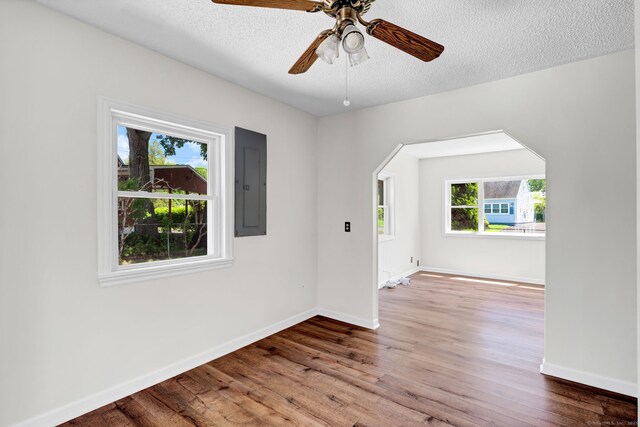 43 Ronald Rd, New Britain, CT 06053 - unfurnished room with electric panel, wood finished floors, baseboards, a textured ceiling, and a ceiling fan