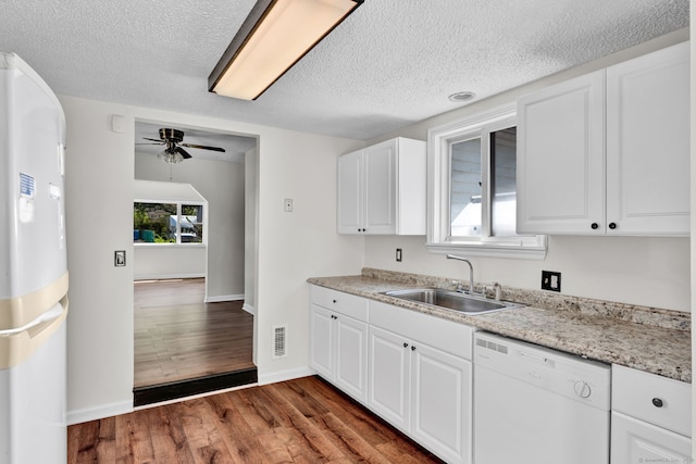 43 Ronald Rd, New Britain, CT 06053 - kitchen with white dishwasher, a sink, ceiling fan, a textured ceiling, and wood finished floors