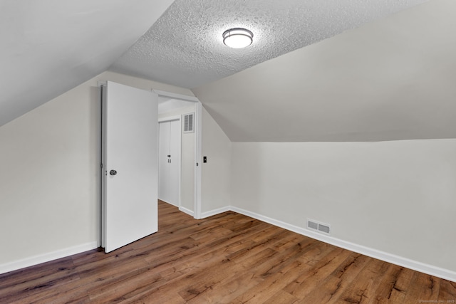 43 Ronald Rd, New Britain, CT 06053 - bonus room with wood finished floors, baseboards, lofted ceiling, and a textured ceiling