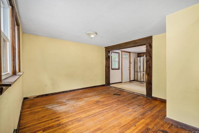 33 Hurlbut Rd, Tolland, CT 06084 - empty room featuring wood-type flooring, baseboards, and a textured ceiling