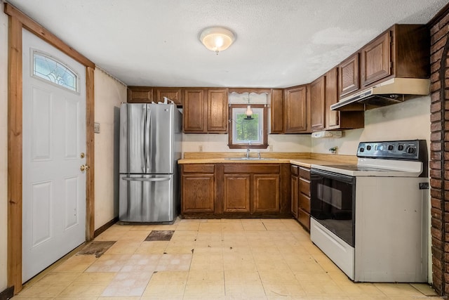 33 Hurlbut Rd, Tolland, CT 06084 - kitchen featuring freestanding refrigerator, electric stove, a sink, light countertops, and light flooring