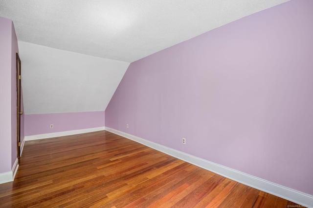 33 Hurlbut Rd, Tolland, CT 06084 - additional living space featuring wood finished floors, lofted ceiling, and baseboards