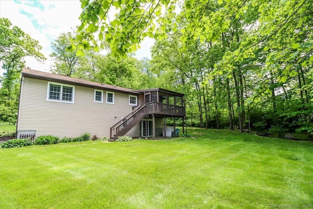 31 Buckingham Rd, New Milford, CT 06776 - rear view of property featuring stairway, a sunroom, a yard, and a wooden deck