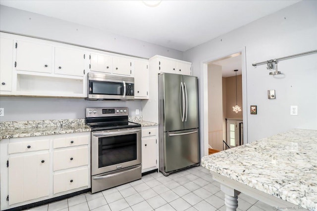 31 Buckingham Rd, New Milford, CT 06776 - kitchen featuring stainless steel appliances, white cabinetry, open shelves, and light stone countertops