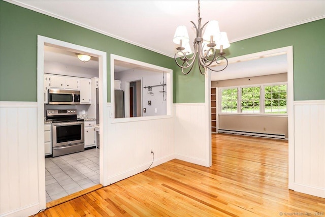 31 Buckingham Rd, New Milford, CT 06776 - unfurnished dining area featuring baseboard heating, wainscoting, a chandelier, light wood-type flooring, and ornamental molding