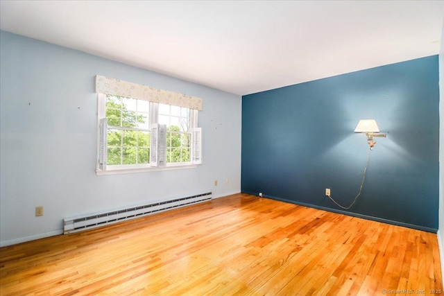 31 Buckingham Rd, New Milford, CT 06776 - empty room featuring baseboard heating, wood finished floors, and baseboards