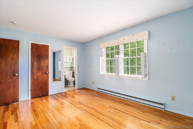 31 Buckingham Rd, New Milford, CT 06776 - unfurnished bedroom featuring baseboard heating, wood finished floors, and ensuite bath