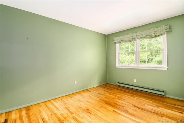 31 Buckingham Rd, New Milford, CT 06776 - unfurnished room with baseboard heating, wood finished floors, and baseboards