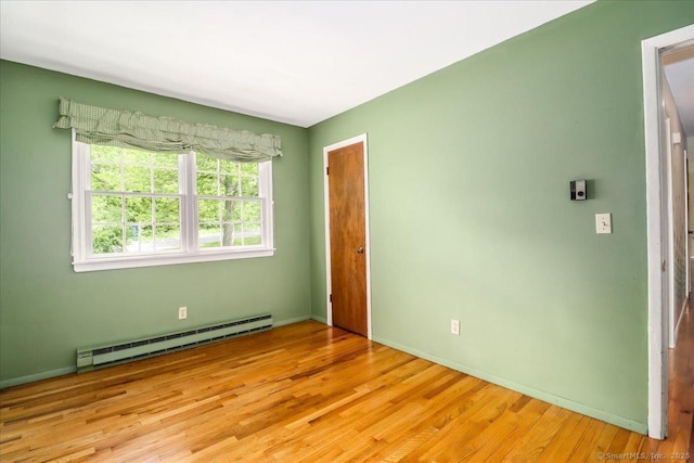 31 Buckingham Rd, New Milford, CT 06776 - empty room featuring baseboard heating, light wood-style flooring, and baseboards