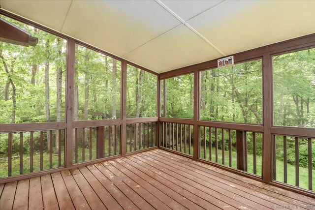 31 Buckingham Rd, New Milford, CT 06776 - unfurnished sunroom featuring a wooded view