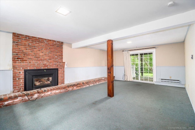 31 Buckingham Rd, New Milford, CT 06776 - unfurnished living room with baseboard heating, carpet flooring, wainscoting, a brick fireplace, and beamed ceiling