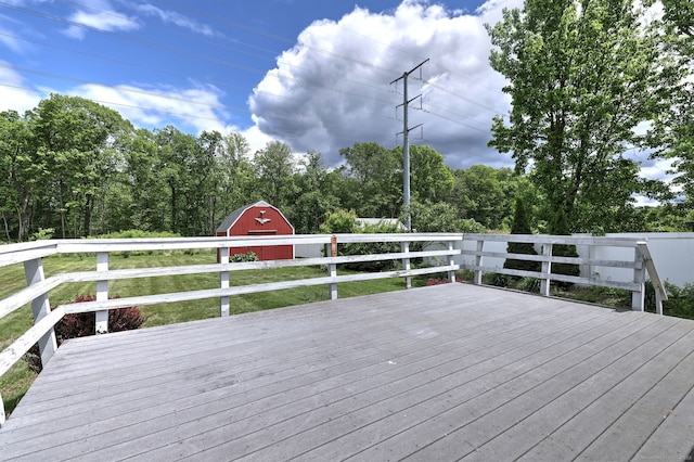 54 Mariot Cir, Wallingford, CT 06492 - wooden deck with a barn and an outdoor structure