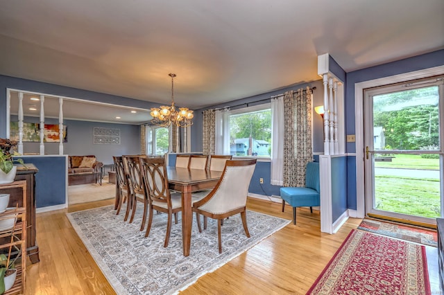 54 Mariot Cir, Wallingford, CT 06492 - dining room with light wood finished floors, a chandelier, and baseboards