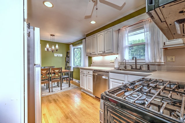 54 Mariot Cir, Wallingford, CT 06492 - kitchen with stainless steel dishwasher, plenty of natural light, a sink, light wood-type flooring, and recessed lighting