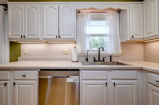 54 Mariot Cir, Wallingford, CT 06492 - kitchen with stainless steel dishwasher, a sink, white cabinetry, and light countertops