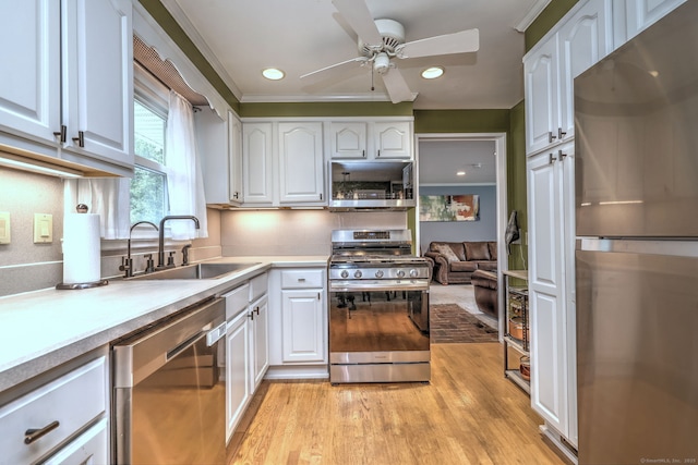 54 Mariot Cir, Wallingford, CT 06492 - kitchen with stainless steel appliances, a sink, a ceiling fan, white cabinets, and recessed lighting