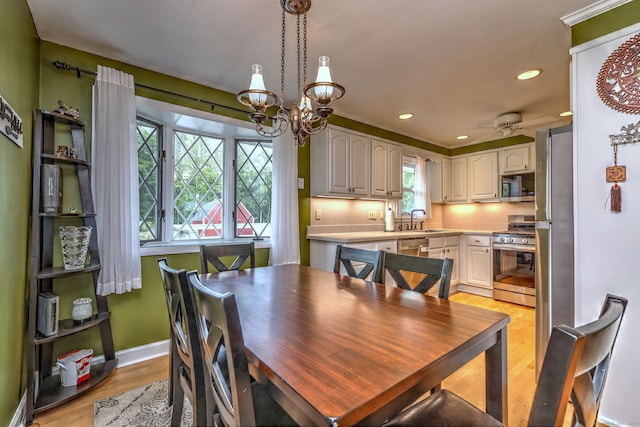 54 Mariot Cir, Wallingford, CT 06492 - dining room with light wood-style flooring, recessed lighting, a chandelier, baseboards, and a ceiling fan