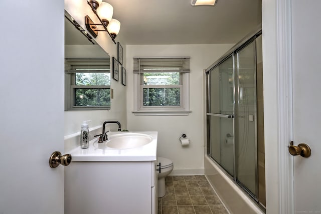 54 Mariot Cir, Wallingford, CT 06492 - full bathroom featuring vanity, toilet, enclosed tub / shower combo, baseboards, and tile patterned flooring