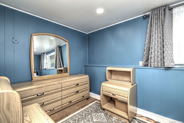 54 Mariot Cir, Wallingford, CT 06492 - bedroom with wood finished floors, a decorative wall, and baseboards