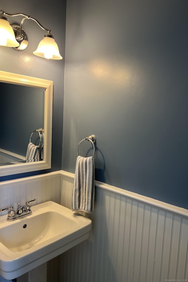 123 Old Belden Hill Rd Apt 5, Norwalk, CT 06850 - bathroom with a sink and a wainscoted wall