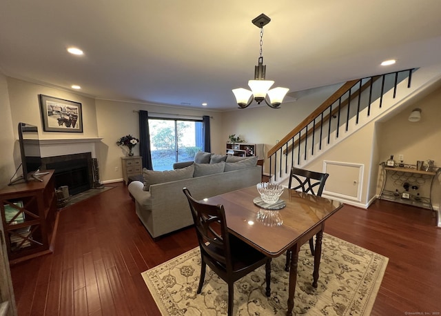 123 Old Belden Hill Rd Apt 5, Norwalk, CT 06850 - dining room with a chandelier, stairway, dark wood finished floors, recessed lighting, and a fireplace with flush hearth