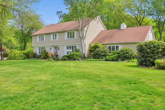 190 Bronson Dr, Middlebury, CT 06762 - colonial home featuring a front yard and a chimney