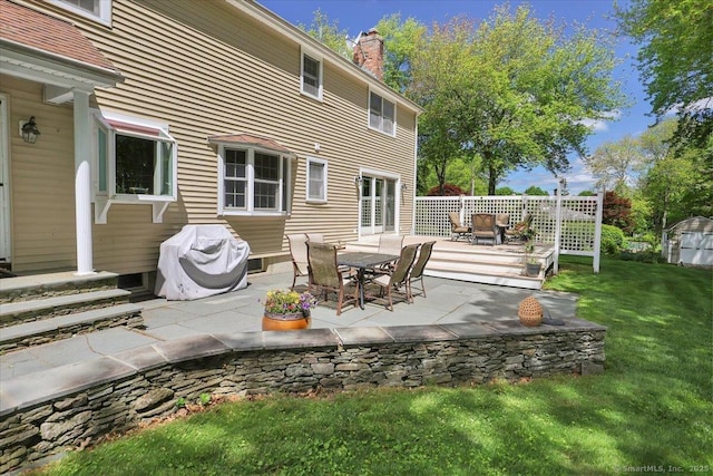 190 Bronson Dr, Middlebury, CT 06762 - view of patio / terrace with grilling area, a deck, outdoor dining area, and a storage unit