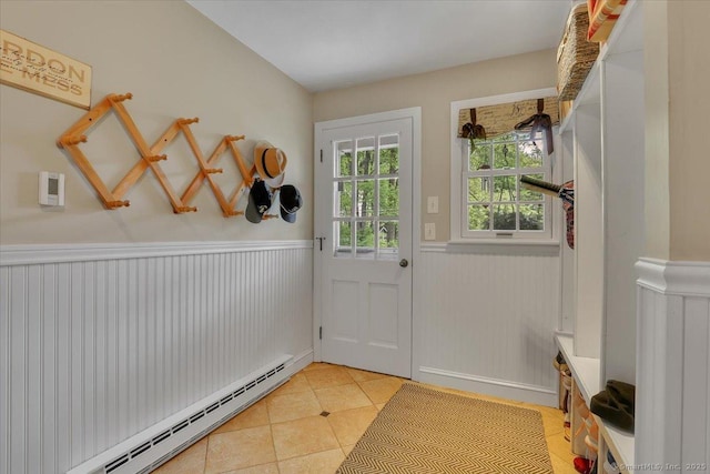 190 Bronson Dr, Middlebury, CT 06762 - doorway featuring a wainscoted wall, baseboard heating, and light tile patterned flooring