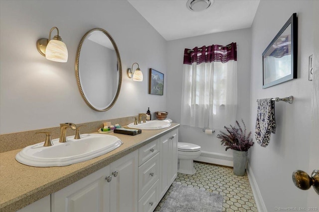 190 Bronson Dr, Middlebury, CT 06762 - full bath with baseboards, double vanity, toilet, and tile patterned floors