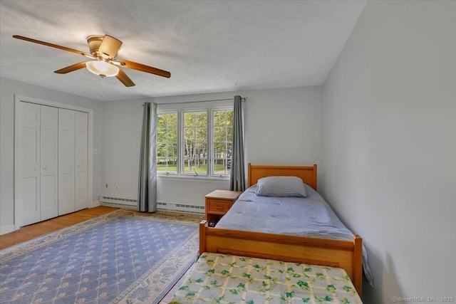 190 Bronson Dr, Middlebury, CT 06762 - bedroom with a baseboard radiator, ceiling fan, wood finished floors, and baseboards