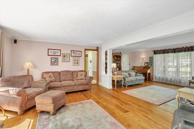 190 Bronson Dr, Middlebury, CT 06762 - living room with crown molding, light wood-style floors, and decorative columns